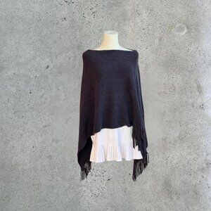 Navy blue fringe knit poncho.